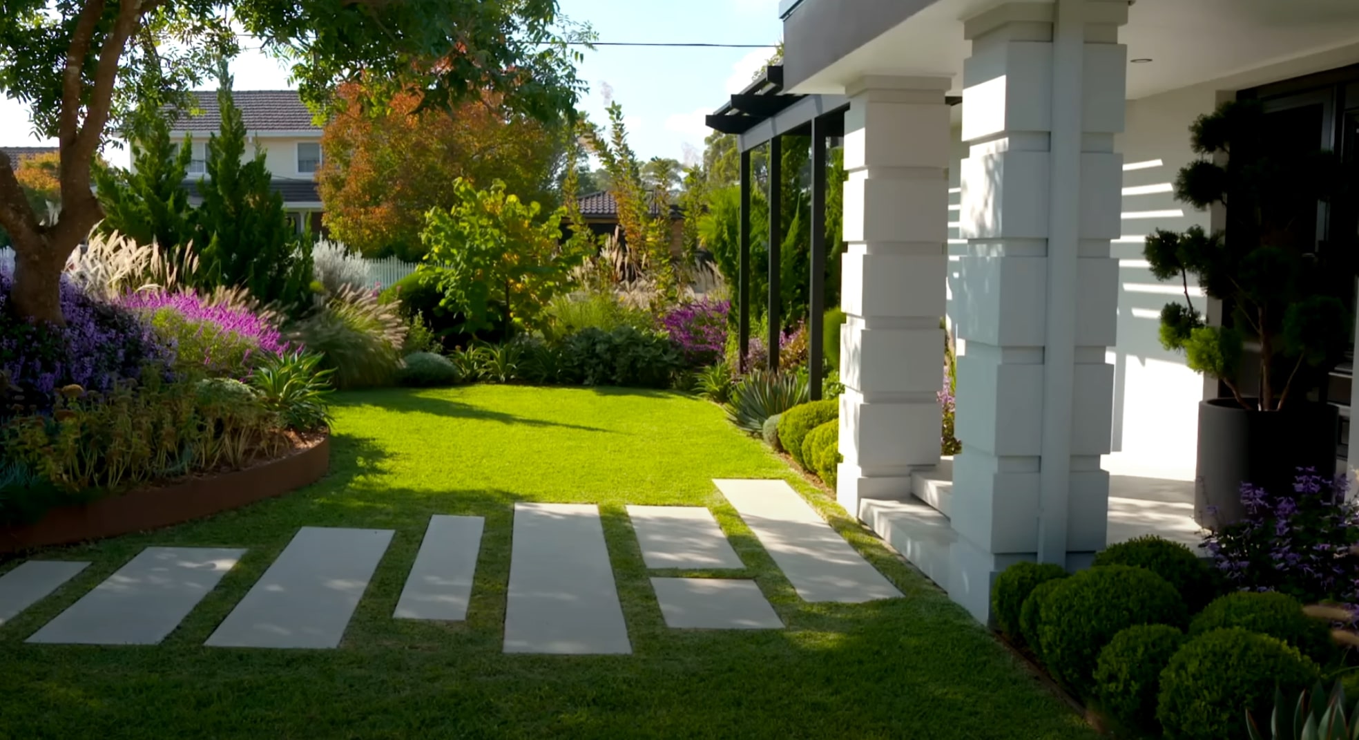 Beautiful mature trees and professional landscape design with mixed plantings